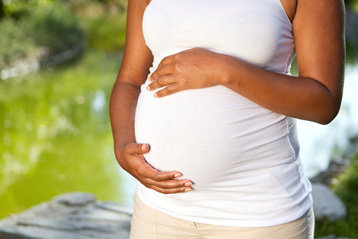 pregnant woman holding belly